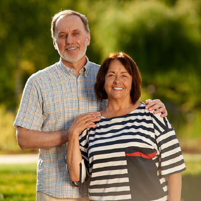 retirement-lifestyle-wealth-security-square A relaxed retired couple in their 60s, confident that their rental and investment portfolios are professionally managed.